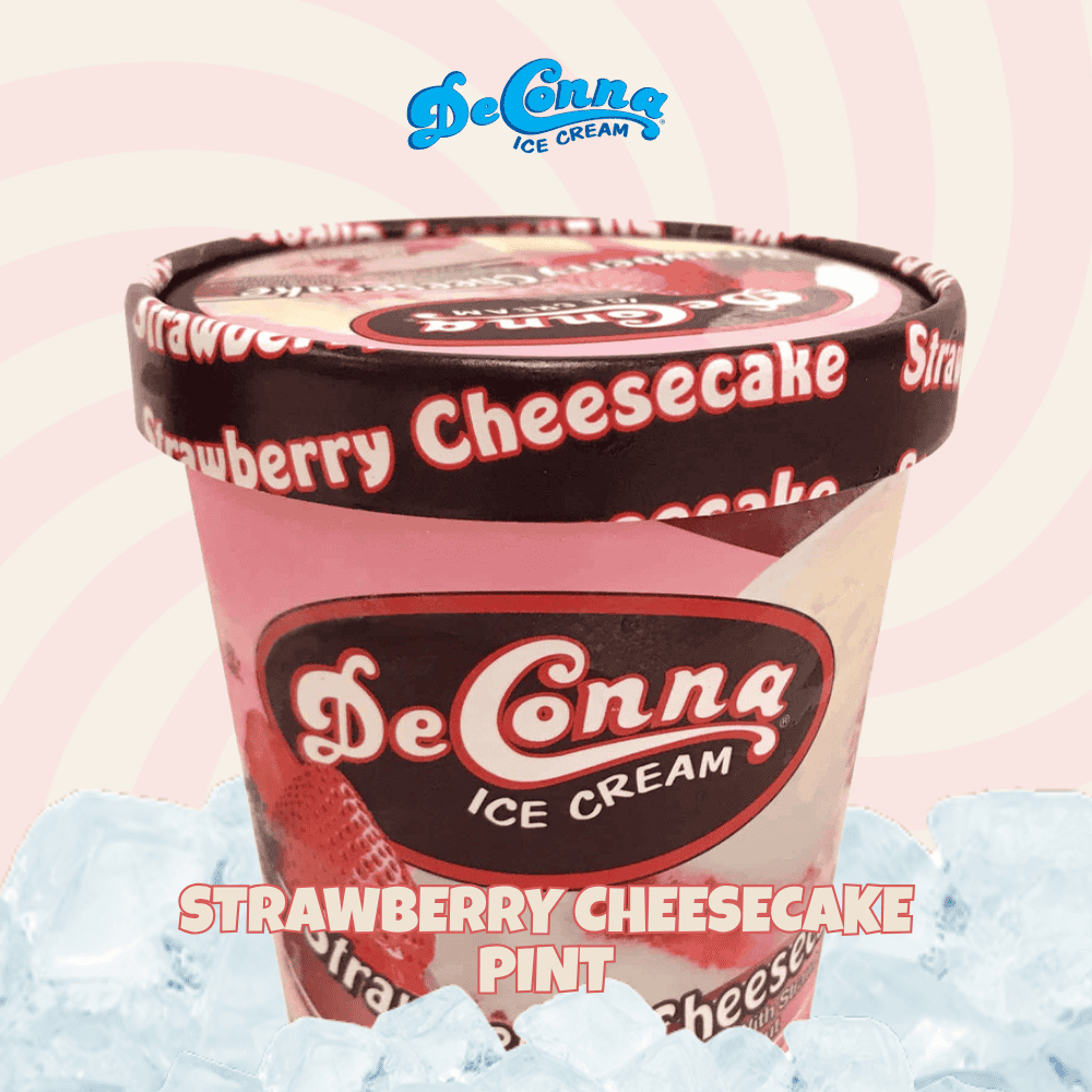DeConna Ice Cream Strawberry Cheesecake pint with pink container and bold logo, set on a pale pink background with ice cubes nearby.