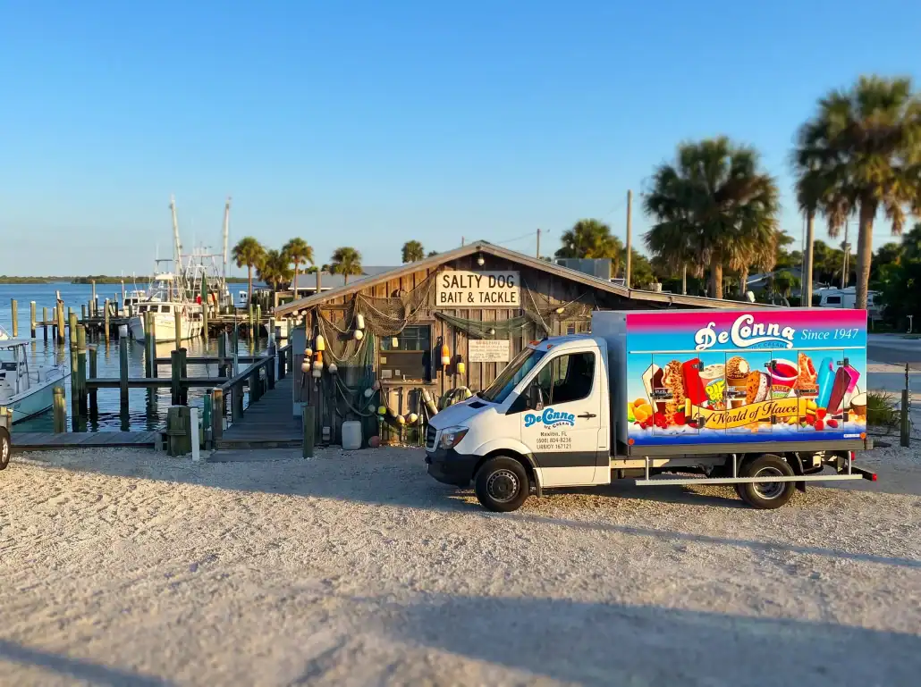 DeConna ice cream delivery truck parked at a waterfront bait and tackle shop in Florida
